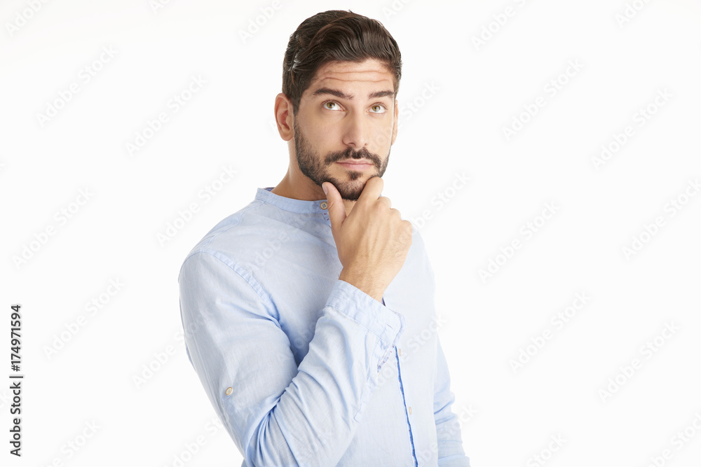 Fototapeta premium Thinking young man portrait