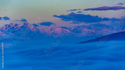Scenic panorama sunset landscape of Crans-Montana range in Swiss Alps mountains with peak in background, Crans Montana, Switzerland.