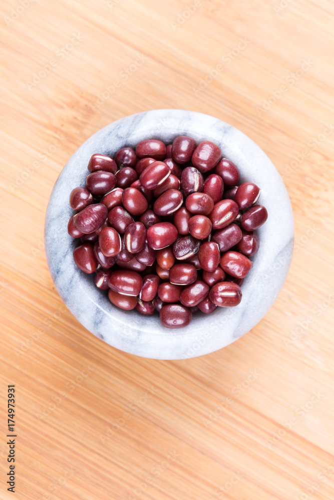 Red adzuki beans on a wood background Red adzuki beans on a wood background