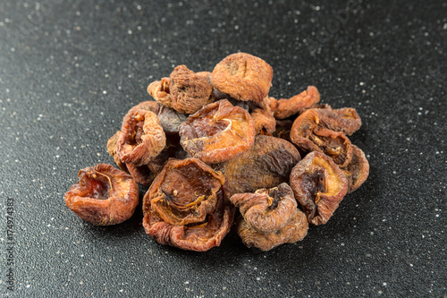 Organic dried apricots on a black background