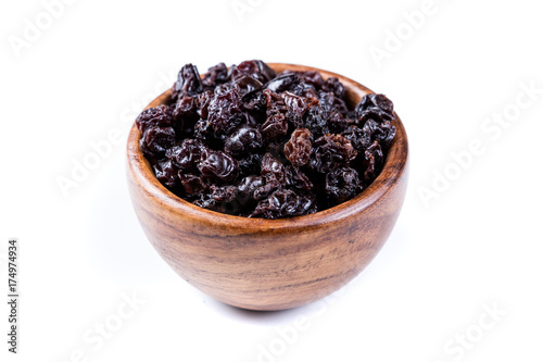 Black organic zante currants isolated on a white background photo