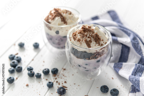 Dessert from yogurt with blueberries and chocolate 