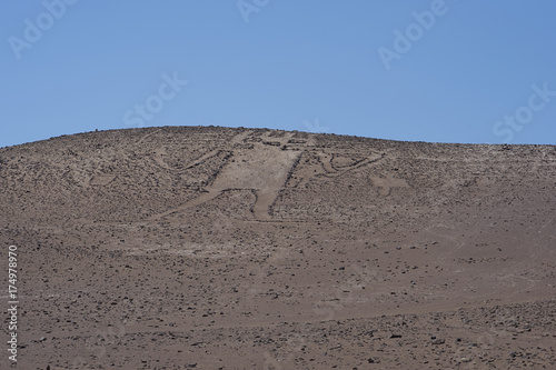 Giant of the Atacama. Large petroglyph on a rocky outcrop in the Atacama Desert in the Tarapaca Region of northern Chile. 