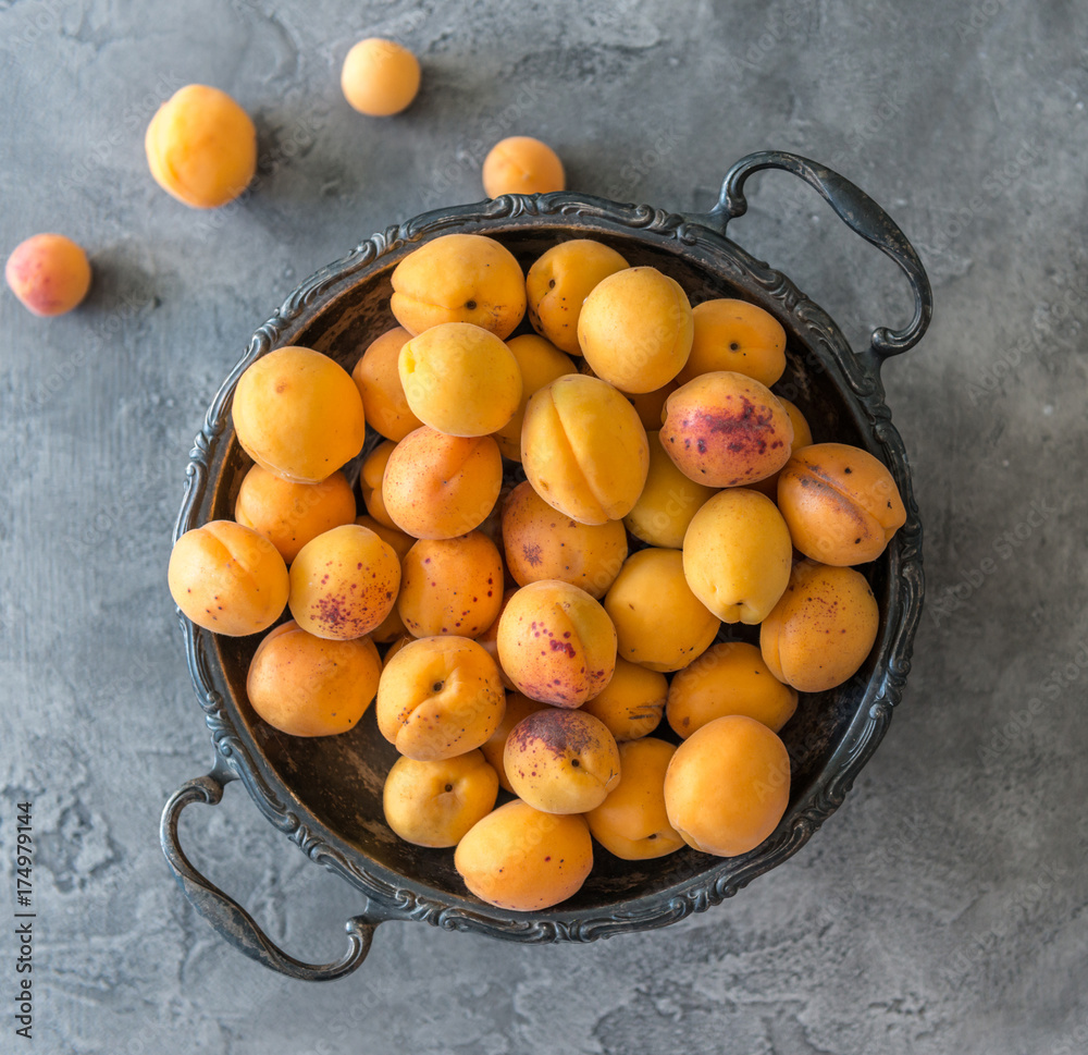 Apricots in metal dishes Apricots in metal dishes