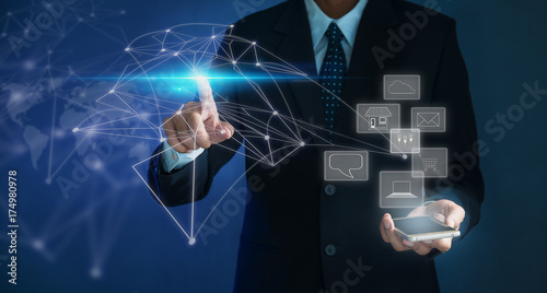 Portrait of a young man holding a phone, raising his hand and pointing fingers, Technology that will help you access your business more easily and freely just the fingertips touch.