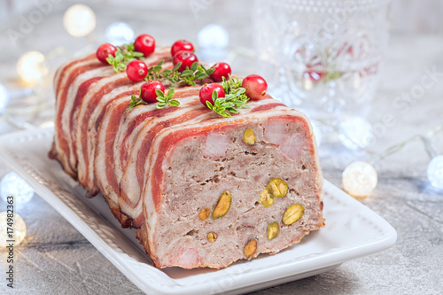 terrine with ground meat, ham and pistachios for Christmas