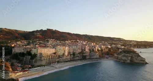 Aerial, drone view of the town Tropea in Calabria. Coast at the evening, sunset time. photo