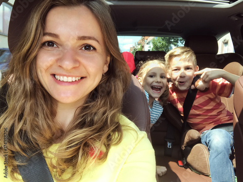 Family selfie photo in car on summer vacation