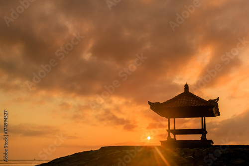 Beautiful sunrise on a beach in Bali Indonesia with colourful sky as background