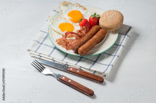Nutritious breakfast, strawberry, bread, coffee orange juice, sausage, egg