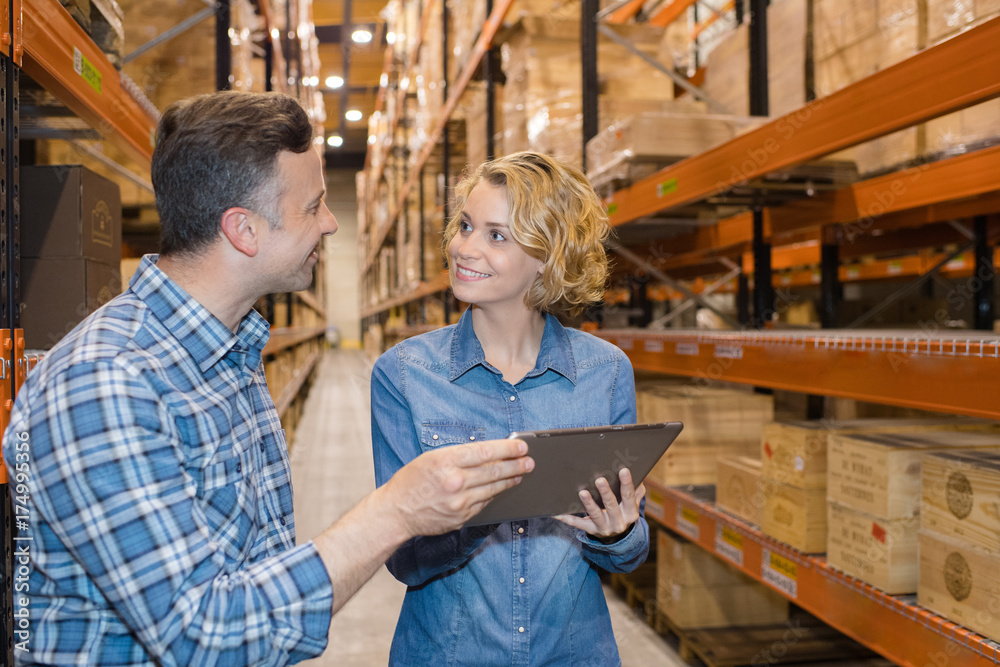 Man and woman in warehouse