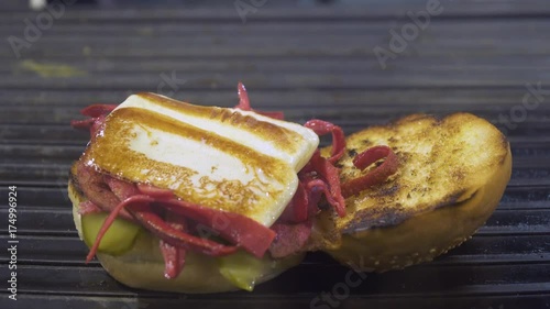 Kumru is a traditional Turkish sandwich on a bun, typically with cheese, tomato, and sausage. Street Food in Izmir Cesme.