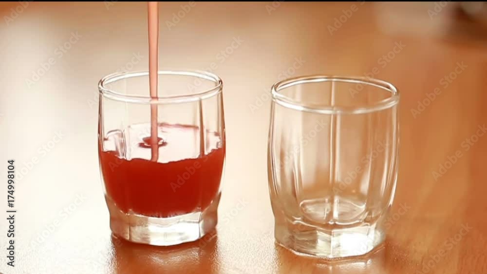 vodka strawberry cocktail, known as XuXu, pouring in a pile. HD close up shot vodka strawberry cocktail, known as XuXu, pouring in a pile. HD close up shot
