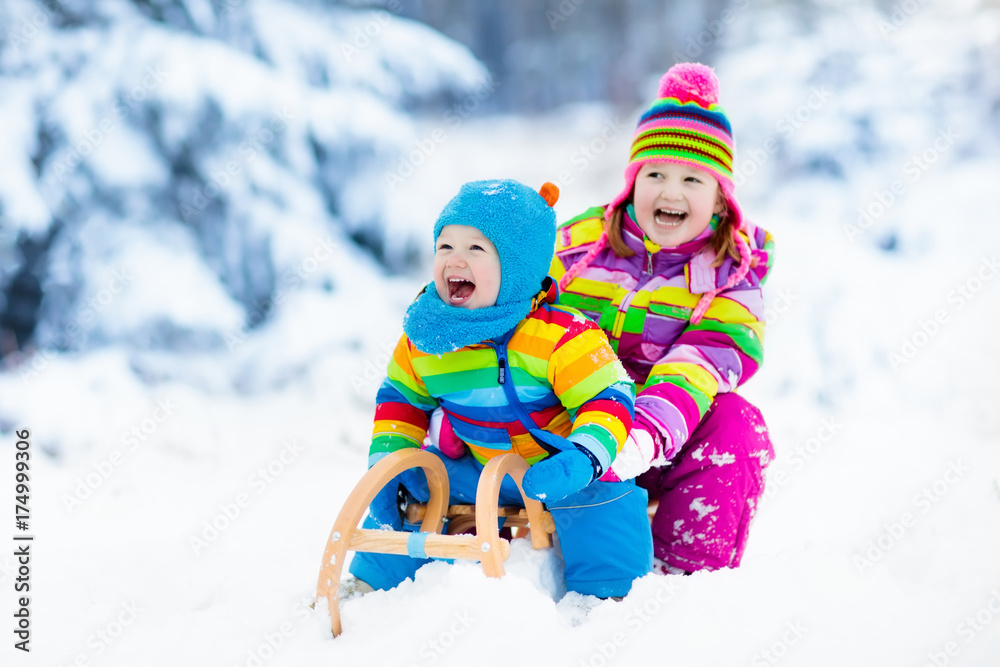 Kids on sleigh ride. Children sledding. Winter snow fun. Kids on sleigh ride. Children sledding. Winter snow fun.