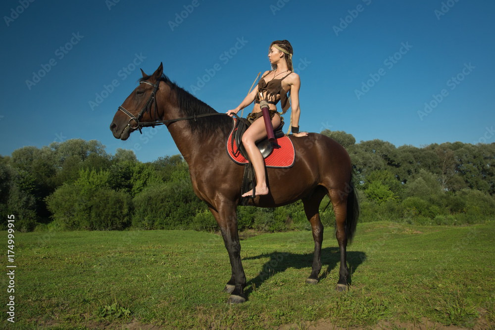 Wild amazon girl on horseback