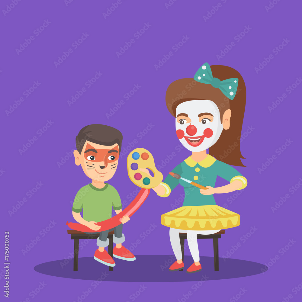 Caucasian woman animator painting the face of a little boy for a party.  Animator drawing a