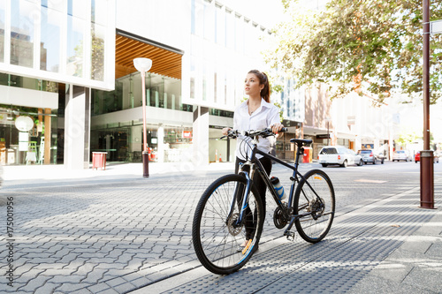 Portrait of happy young female bicyclist