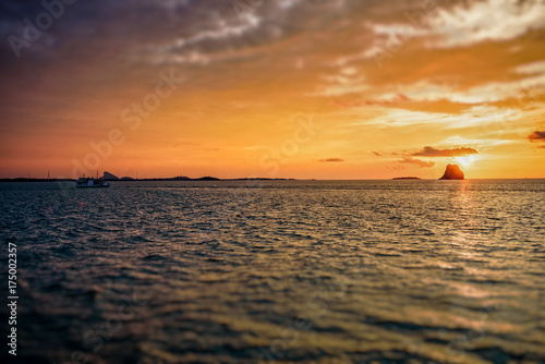 Beautiful natural landscape of colorful cloud sky and sun at sunset over the sea in Surat Thani province  Thailand