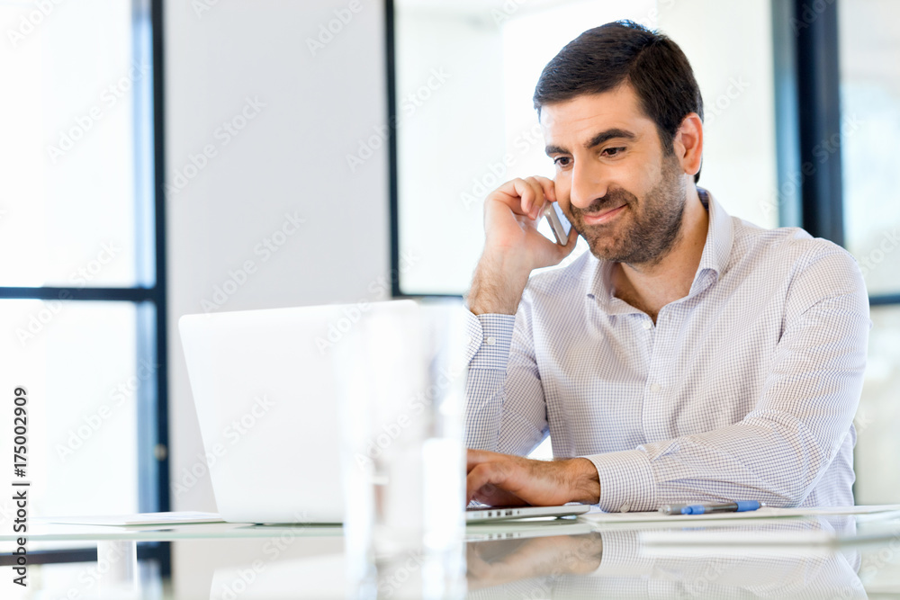 Confident young man in smart casual wear holding phone Confident young man in smart casual wear holding phone
