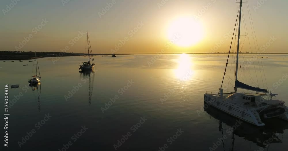 Sunrise aerial seascape view of Olhao dockyard, waterfront to Ria Formosa natural park with Armona island in background. Algarve. Portugal. Sunrise aerial seascape view of Olhao dockyard, waterfront to Ria Formosa natural park with Armona island in background. Algarve. Portugal.