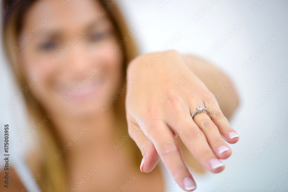woman showing her engagement ring woman showing her engagement ring