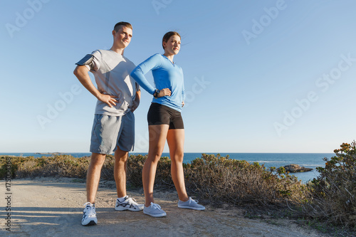 Young couple on beach training together © Sergey Nivens