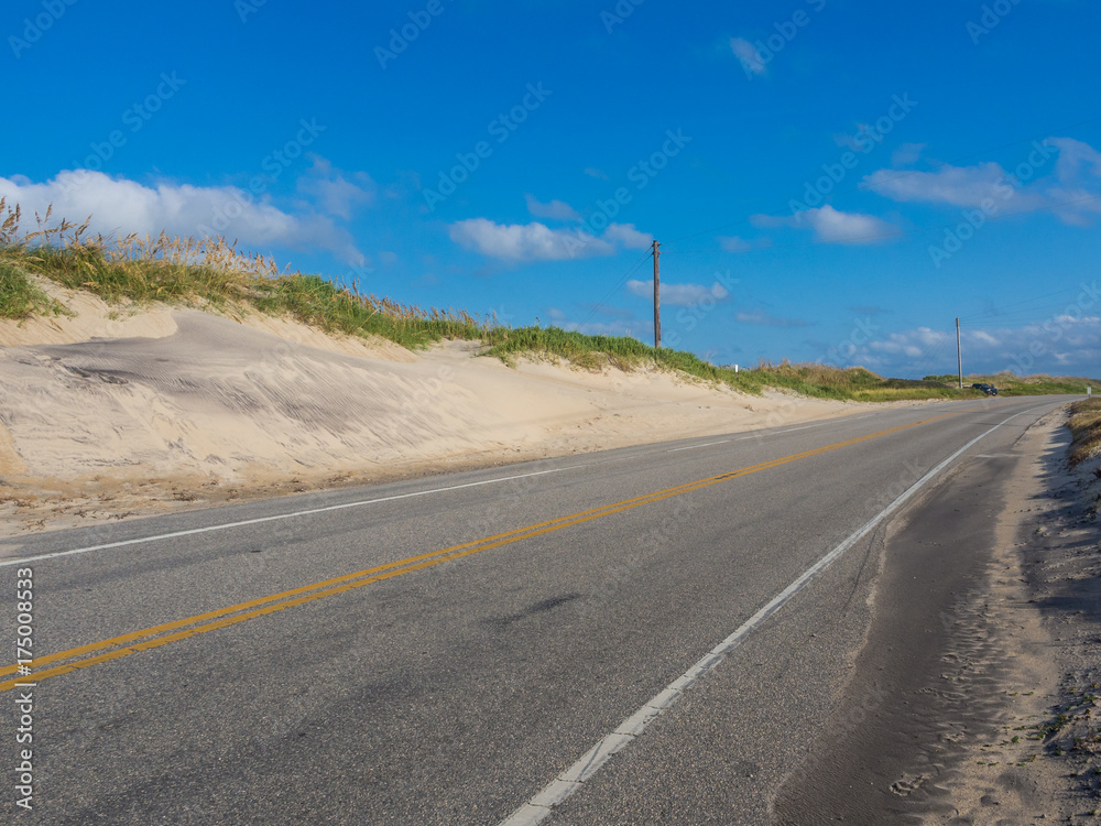 Road accross the sand dunes at
