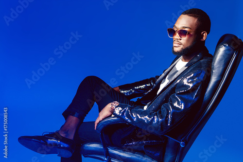 A black man with glasses. A...