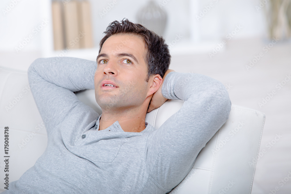man relaxing on the sofa at home man relaxing on the sofa at home