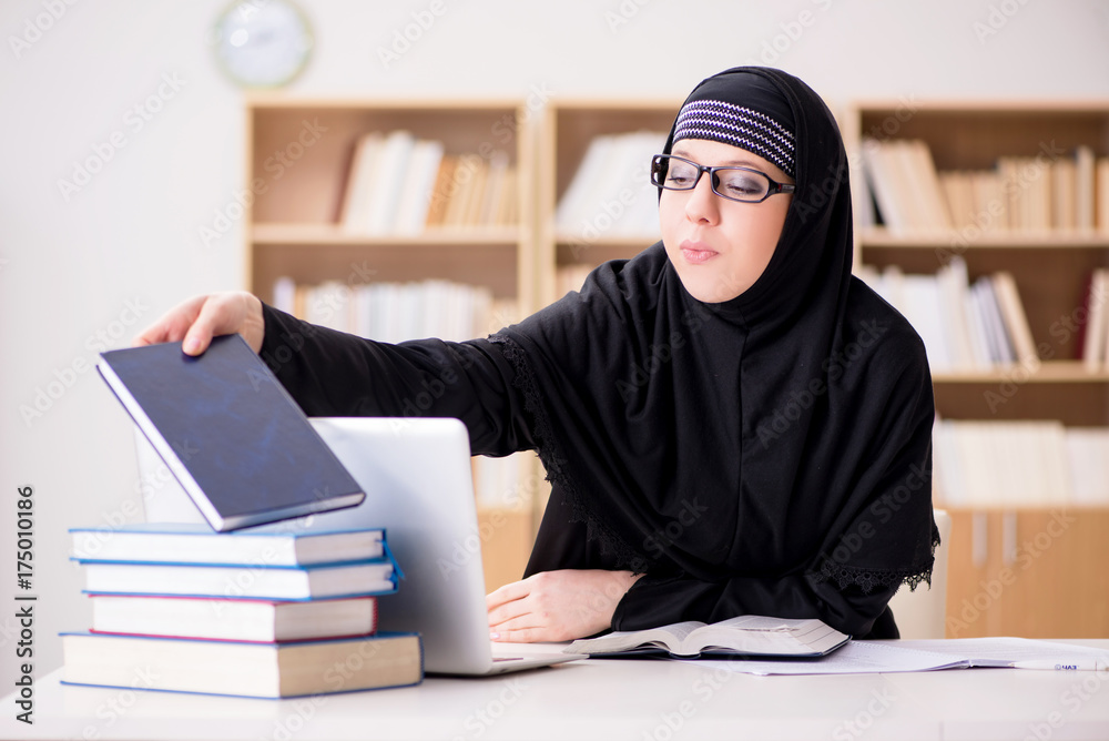 Muslim girl in hijab studying preparing for exams Muslim girl in hijab studying preparing for exams