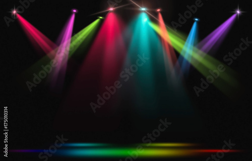 Stage lights. Rainbow spotlight strike through the darkness.