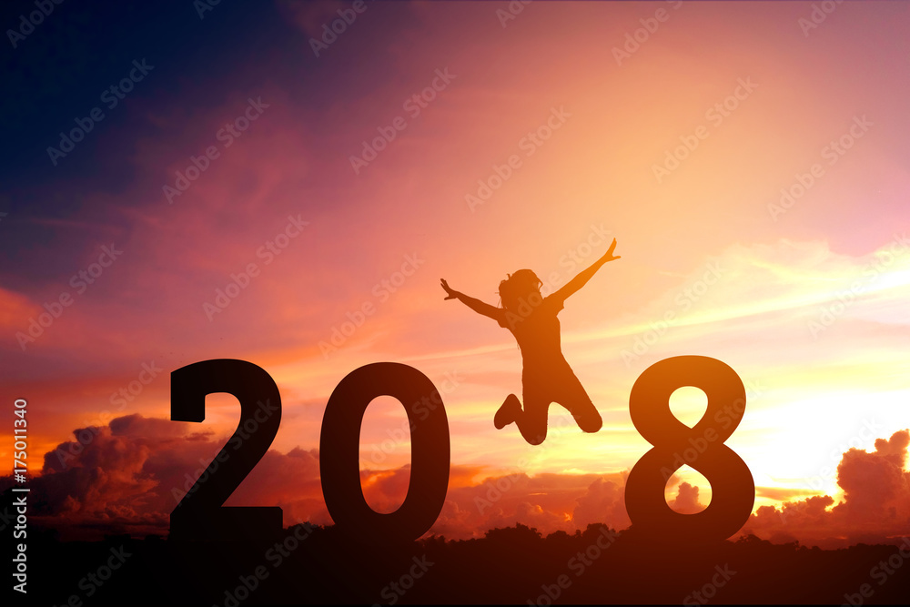 Silhouette young woman jumping to 2018 new year Silhouette young woman jumping to 2018 new year