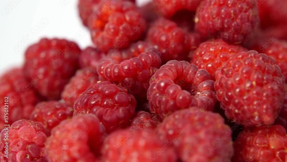 Heap of fresh raspberries rotating on white background. 4K Ultra High-Definition. Heap of fresh raspberries rotating on white background. 4K Ultra High-Definition.