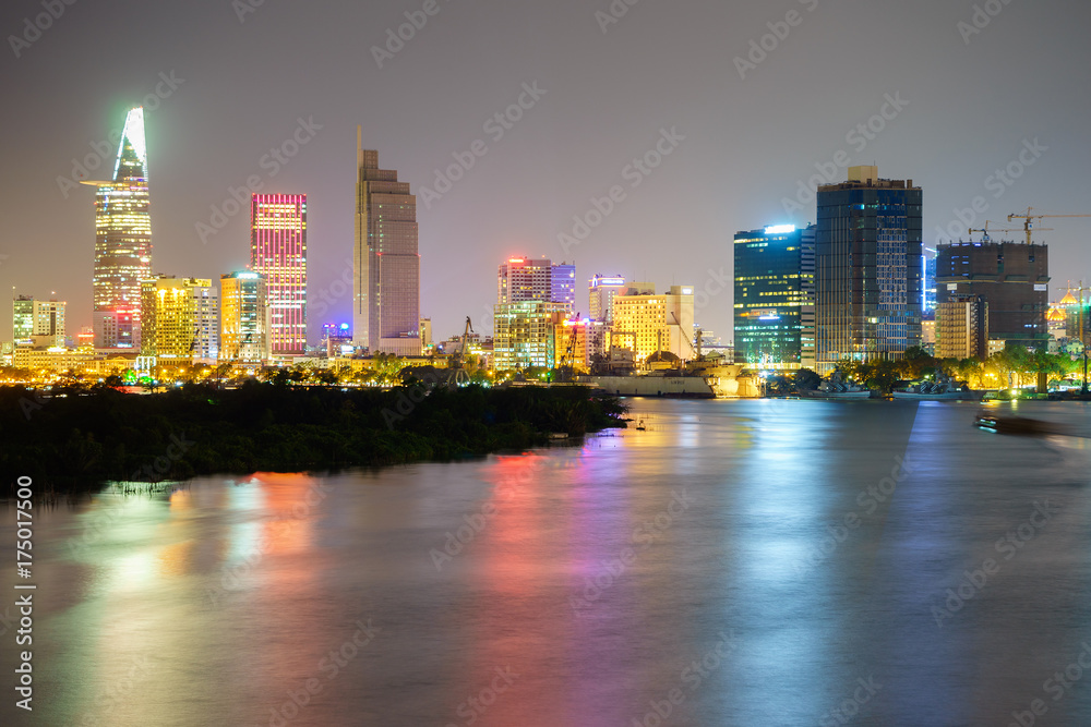 Φωτογραφία Night view of Business and Administrative Center of Ho Chi Minh city on Saigon riverbank in twilight, Vietnam