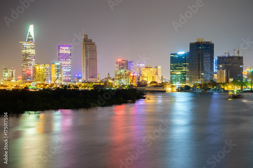 Night view of Business and Administrative Center of Ho Chi Minh city on Saigon riverbank in twilight, Vietnam.   © tranquocphongvn