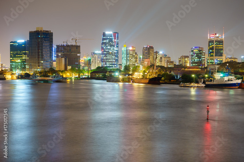 Night view of Business and Administrative Center of Ho Chi Minh city on Saigon riverbank in twilight, Vietnam. 
