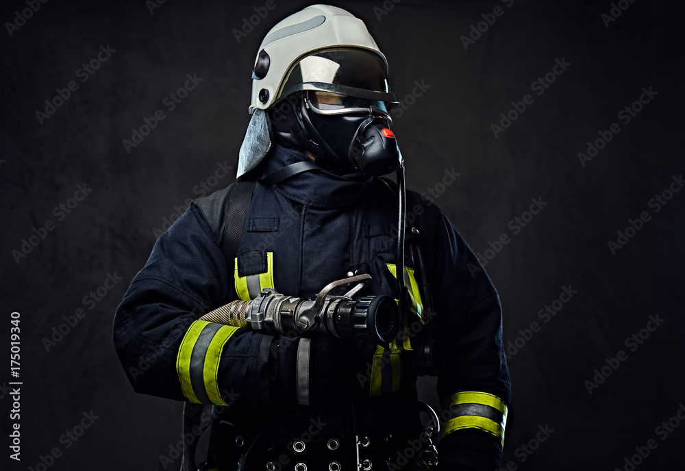 Fototapeta premium Firefighter dressed in uniform and an oxygen mask.