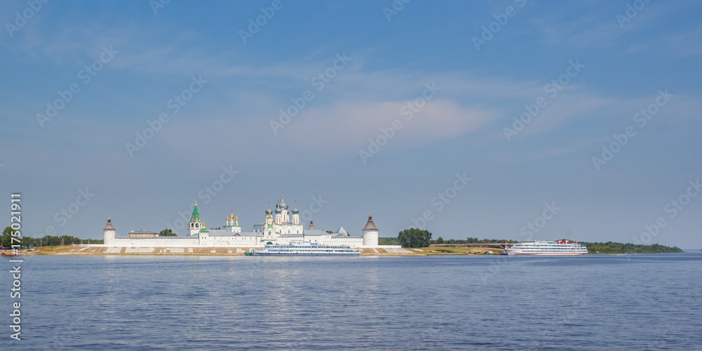 View of the Makarevsky Monastery and the wharf with the boat from the Volga River