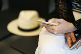 close up focus woman hand checking flight schedule in airport,business traveling concept
