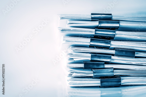 extreamly close up  the stacking of office working document with paper clip folder