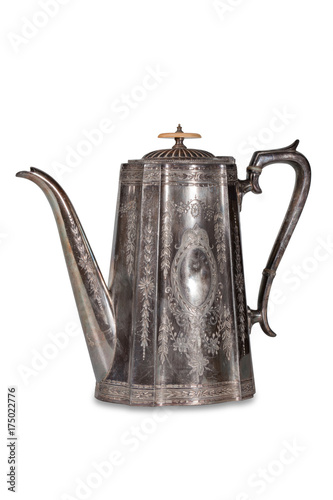 Old metallic teapot on a white background