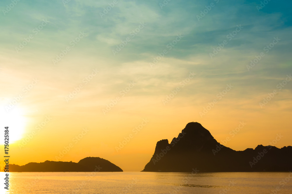 Bright colors at dawn on the beach at sunrise in the Gulf of Thailand.