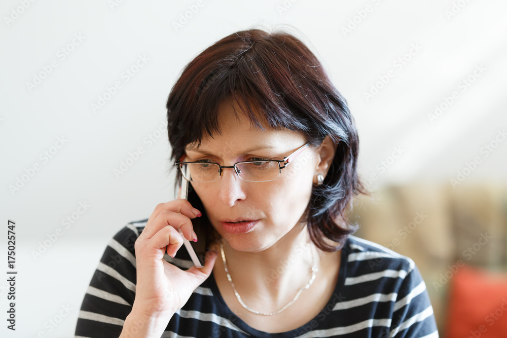 tired middle-aged woman call by phone tired middle-aged woman call by phone