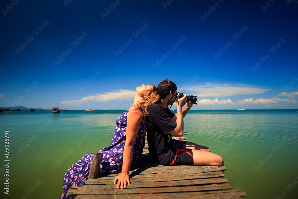 Man Photos Girl Leans on Him against Seascape Sky