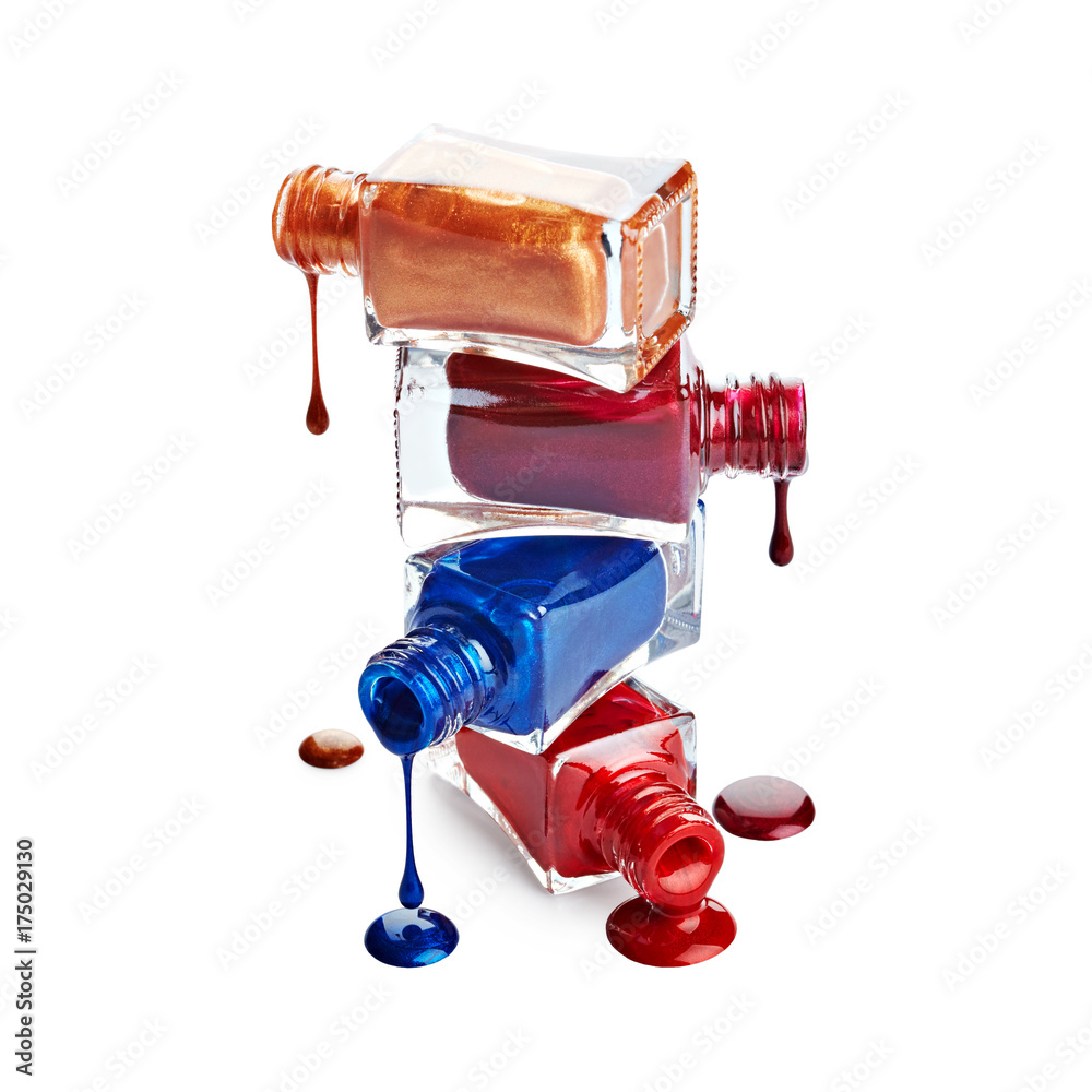 Stack of bottles with spilled nail polish isolated on white background Stack of bottles with spilled nail polish isolated on white background