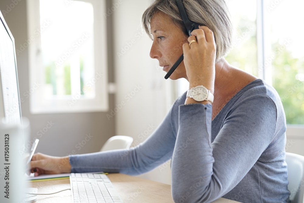 Senior sales representative working in office Senior sales representative working in office