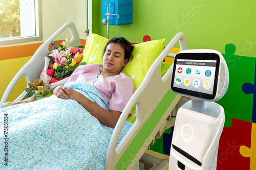 Robotic advisor service technology in healthcare smart hospital , artificial intelligence concept. Robot in patient room. photo