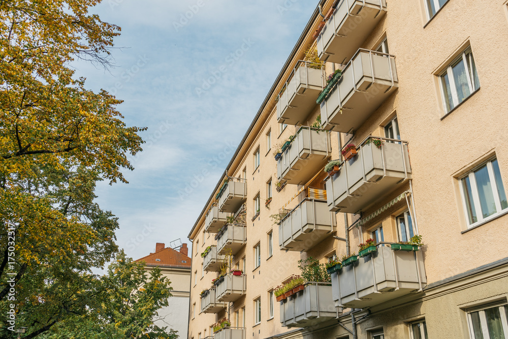 Fototapeta premium yellow apartment building with big balcony