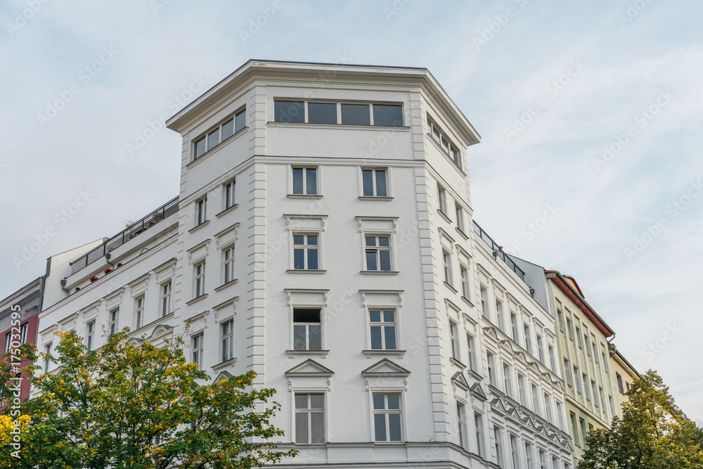white facaded corner building in berlin