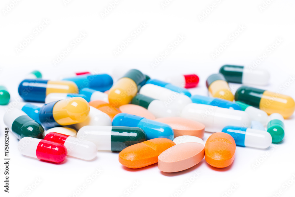 colored pills and capsule on white background colored pills and capsule on white background